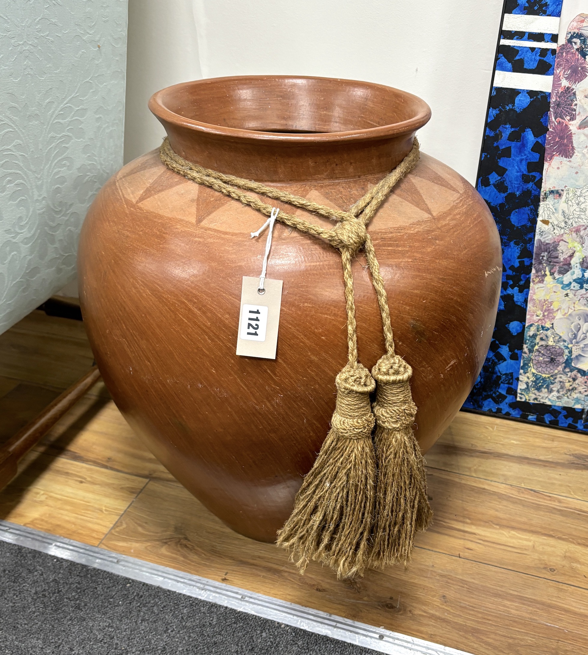 A large glazed earthenware urn, height 54cm